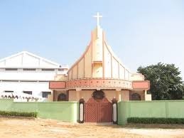 Which historic city in Assam draws the highest number of visitors for its colonial churches and museums?